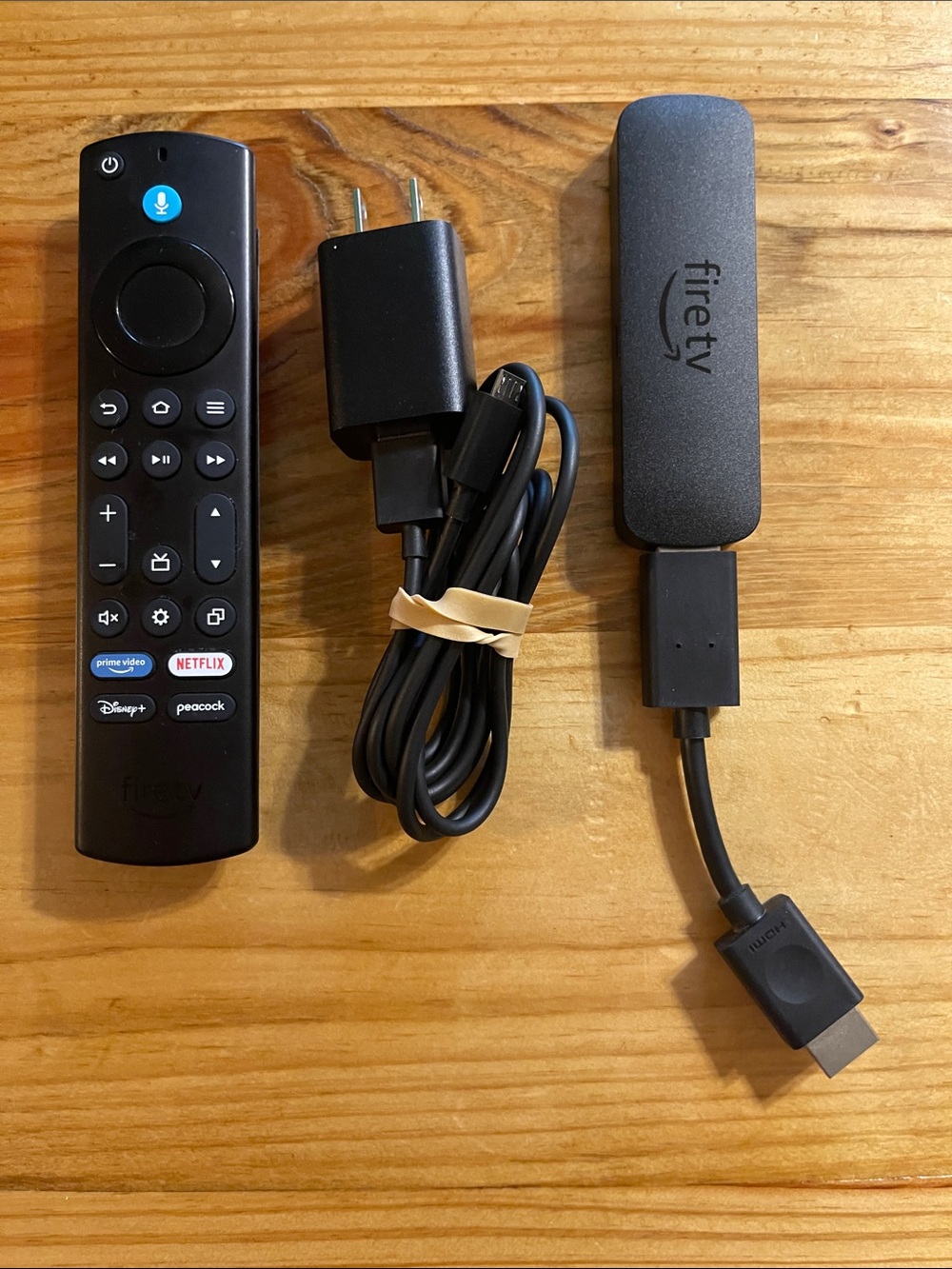 Amazon Fire TV Stick Lite in black with USB power cable